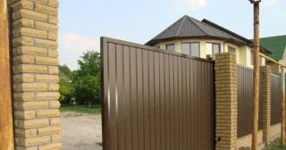 Купить откатные ворота из профнастила Шарыпово, цена от 1757 руб.
